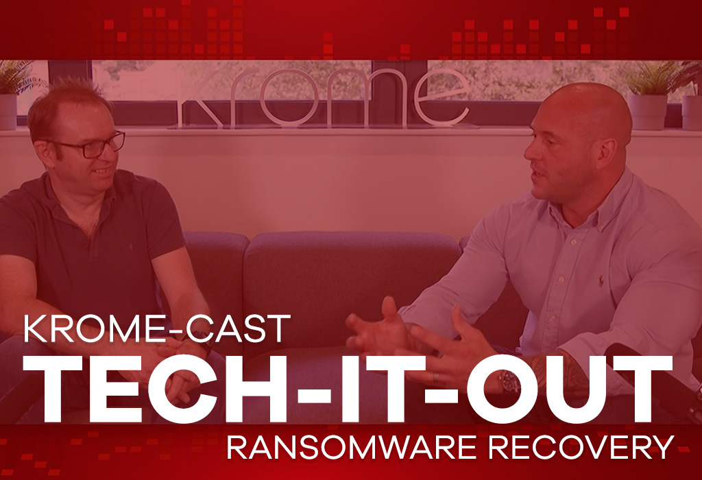 Two men having a discussion in front of a red backdrop with the text "krome-cast tech-it-out ransomware attacks recovery.